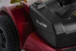 Close-up of the burgundy rear panel of the Merits Roadster 4 showing the "Roadster" logo and part of the battery compartment.